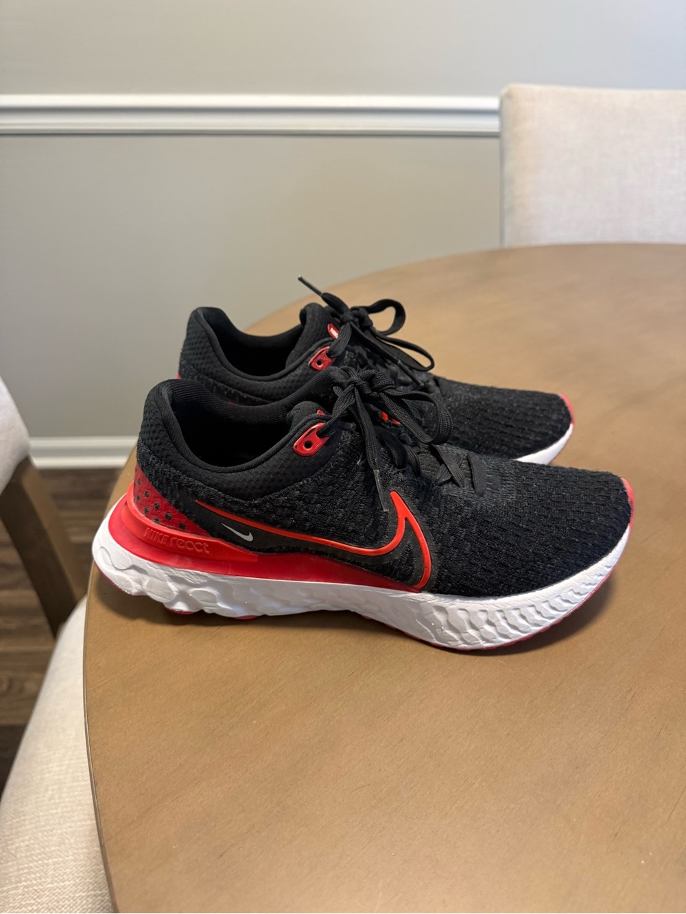 Nike women’s React Infinty Run Flyknit 3 in Black/Bright Crimson/University Red